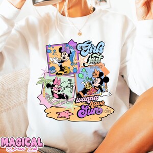 May include: White sweatshirt with a colorful graphic print featuring Mickey Mouse and Minnie Mouse characters. The graphic includes the text "Girls Just Wanna Have Sun".