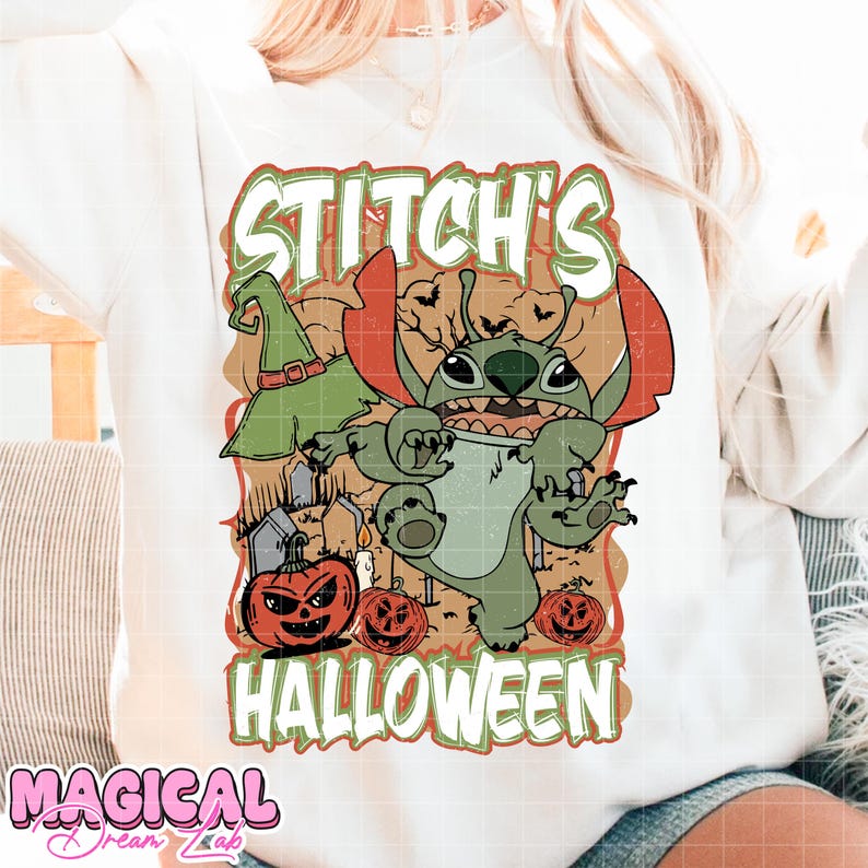 May include: White sweatshirt featuring a Halloween-themed graphic. The design includes the text "Stitch's Halloween" with a cartoon character, pumpkins, and a witch's hat. The sweatshirt has a crew neck and long sleeves.