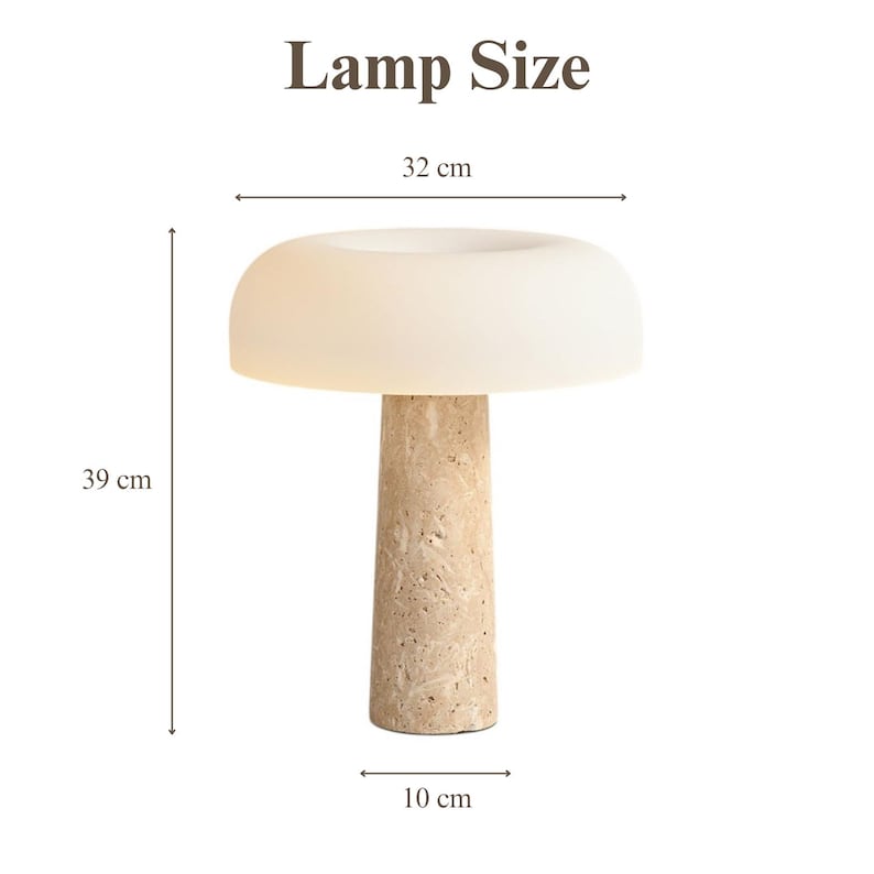 May include: A beige table lamp with a mushroom-shaped lampshade. The lamp has a textured, cylindrical base. The dimensions are 39 cm high, 32 cm wide, and 10 cm in diameter. The text "Lamp Size" is at the top.
