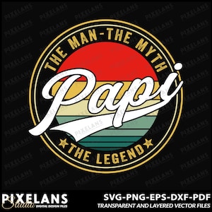 May include: A vintage-style graphic design with a black circle and gold trim. The text "The Man-The Myth-Papi-The Legend" is written in a white font with a retro-style font. The background is a colorful gradient of red, orange, yellow, green, and blue.