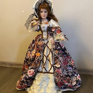 Vintage Victorian Porcelain Doll with curly hair