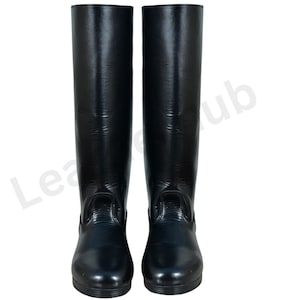May include: A pair of tall, black riding boots. The boots are made of a shiny material and have a smooth, sleek appearance. They are designed to reach the mid-calf and have a classic equestrian style.