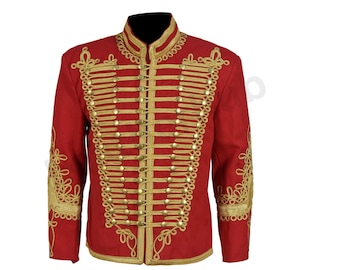 May include: A red military-style jacket with gold-colored trim and decorative accents. The jacket features a high collar, gold rope detailing, and rows of gold buttons down the front. The sleeves have gold embroidery.