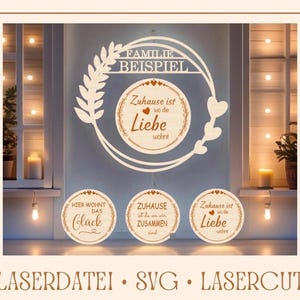 May include: Three wooden signs with a laser cut design. The top sign says "Familie Beispiel" and has a wreath with hearts. The middle sign says "Hier wohnt das Glück" and the bottom sign says "Zuhause ist wo die Liebe wohnt".