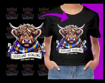 May include: Black t-shirt with a cartoon Highland cow wearing a blue, yellow, and purple scarf. The text "Scotland is calling and I must go!" is printed on the shirt.