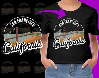 Puede incluir: Camiseta negra con un gráfico blanco del Puente Golden Gate en San Francisco, California. El gráfico incluye el texto "San Francisco California".
