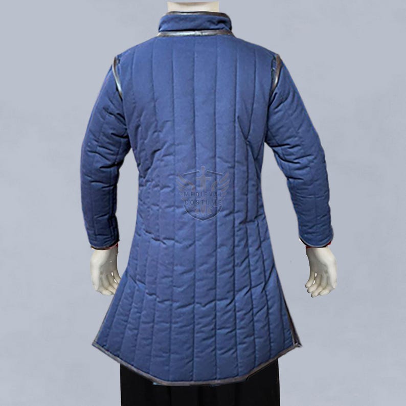 Side profile of medieval padded aketon jacket in royal blue with buckle closures