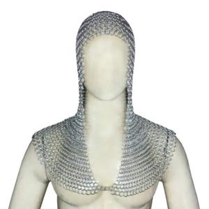 May include: A silver chainmail coif with a hood and a collar. The coif is made of interlocking metal rings.