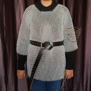 High-quality handmade chainmail armor shirt being worn with a leather belt for a Viking or Knight costume.
