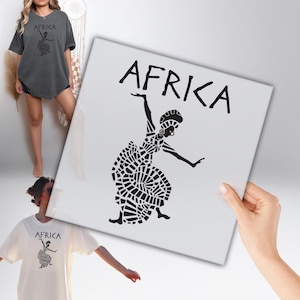 May include: A gray t-shirt with the word "AFRICA" and a black graphic of a dancing figure. The shirt is worn by a person. A white square with the same graphic is held in the image.
