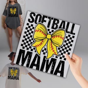 a woman holding up a softball mom sign