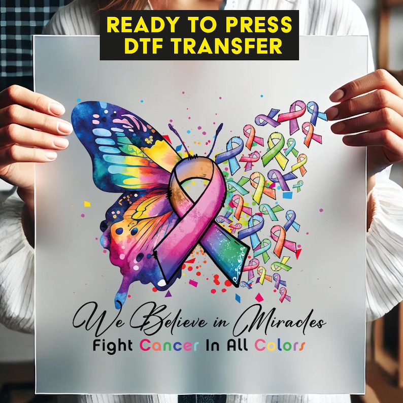 a woman holding a sign with a butterfly on it
