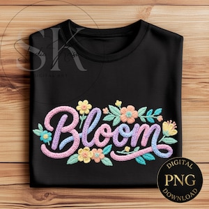 May include: Black t-shirt with the word "Bloom" embroidered in pastel colors. The word is surrounded by embroidered flowers and leaves in shades of pink, blue, yellow, and green. A digital PNG download is also available.