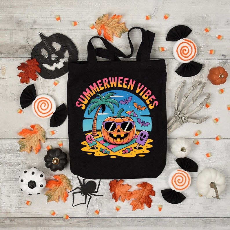 May include: Black tote bag with the text "Summerween Vibes" and a graphic of a pumpkin wearing sunglasses on a beach. The image is surrounded by Halloween and summer themed decorations, including candy corn and fall leaves.