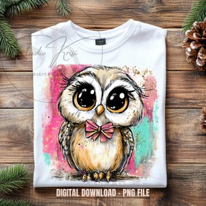 May include: White t-shirt featuring a colorful illustration of an owl with large, expressive eyes and a pink bow tie. The design includes pink, teal, and gold accents. The text "DIGITAL DOWNLOAD - PNG FILE" is at the bottom.