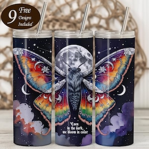 May include: Three stainless steel tumblers with a celestial butterfly design. The butterfly has rainbow-colored wings and a large moon in the background. The text "Even in the dark, we bloom in color" is printed on the tumbler. Each tumbler includes a straw and a lid.