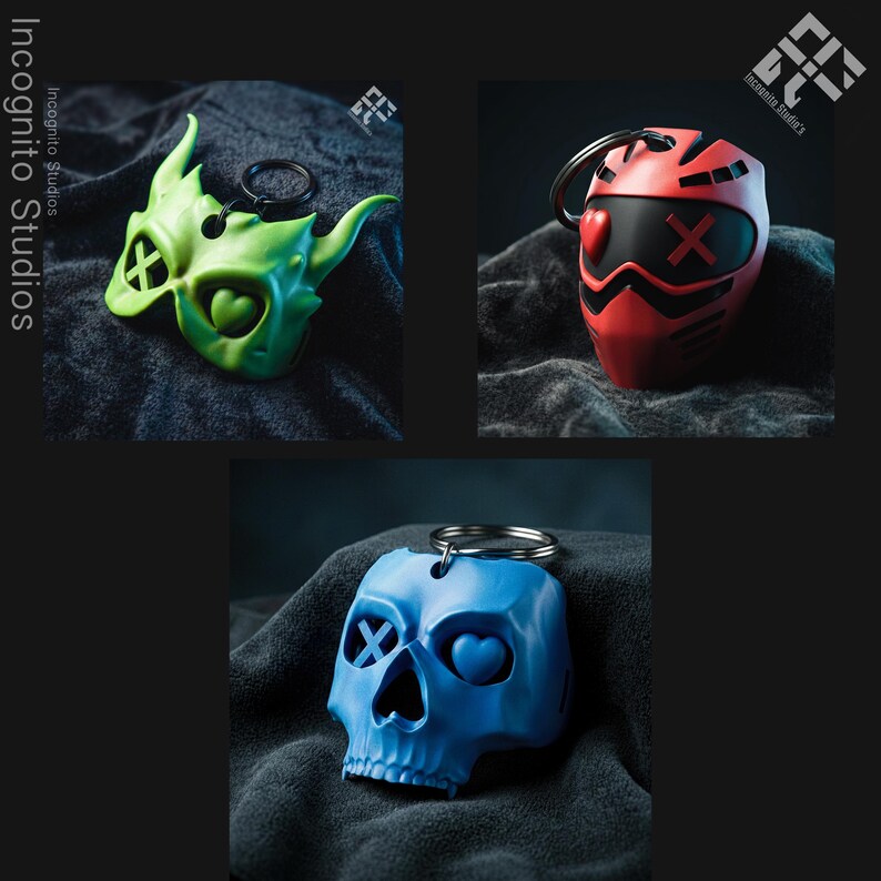 May include: Three keychains with unique designs. One is a green mask with an X and heart, another is a red helmet with an X and heart, and the last is a blue skull with an X and heart. All have a silver key ring.