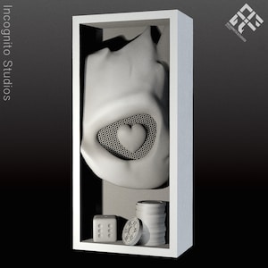 May include: A white display case featuring a sculpted form with a heart-shaped cutout. Inside, there's a die, poker chips, and a stack of chips. The text "Incognito Studios" is visible on the left side of the case.