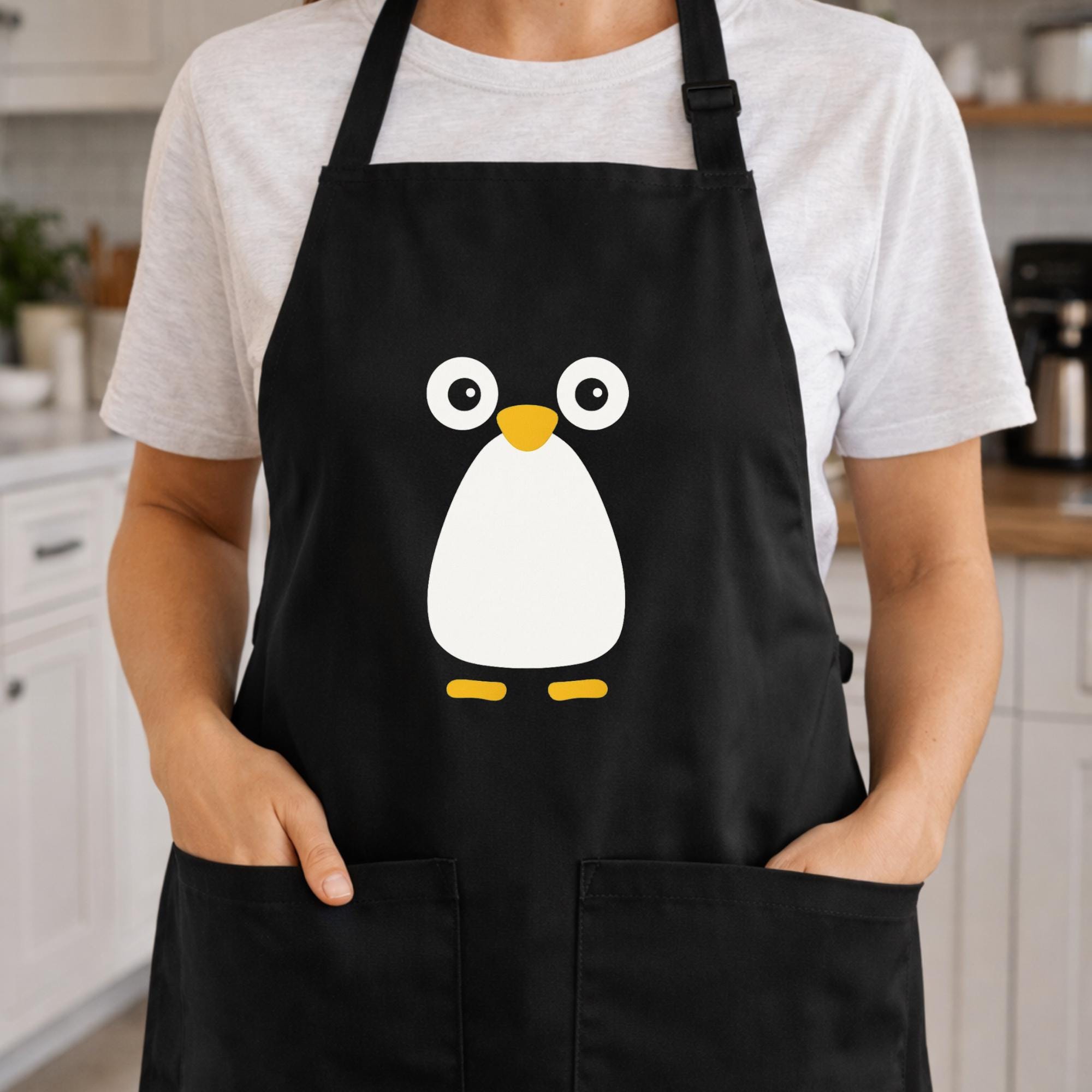 かわいいペンギンのエプロン、ミニマリストの動物アート、料理好きの