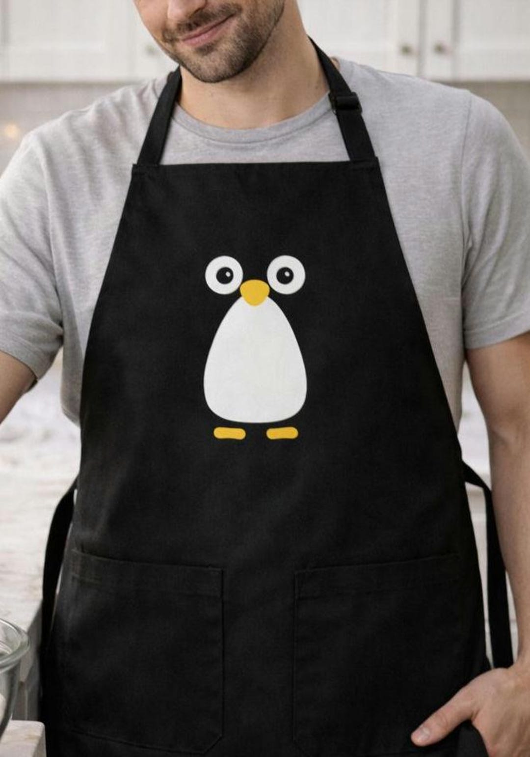 かわいいペンギンのエプロン、ミニマリストの動物アート、料理好きの