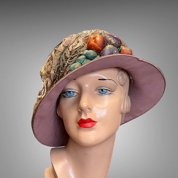 1915/20s  straw hat with veil and silk fruit.