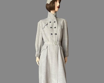 1950’s navy and white trench styled rain coat with matching cap, 38” bust and smaller