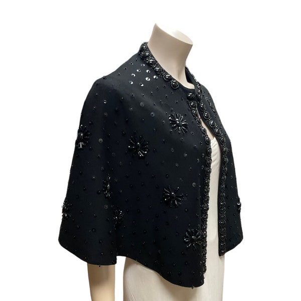 1960’s beaded black knit wool cape with silk lining.