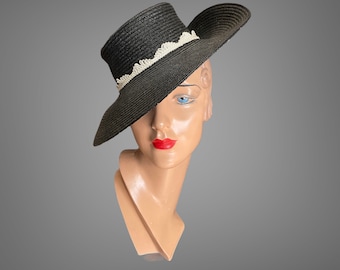 Late 40’s black straw hat with ivory braid trim.