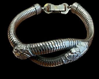 1940 Silver tone metal snake bracelet.