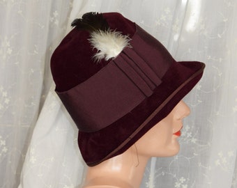 1920's Tyrolese Burgundy Felt Cloche with feather trim.