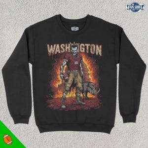 May include: Black sweatshirt with a graphic of a skeleton football player wearing a red jersey and holding a football. The text "WASHINGTON" is above the player.