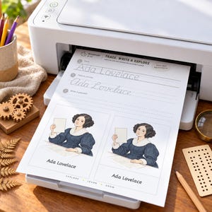 May include: A white printer outputting a worksheet titled Trace, Write & Explore featuring Ada Lovelace. The page includes cursive practice lines, two illustrations of Ada Lovelace in a dark blue dress with a white collar, and the text Ada Lovelace.