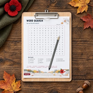 May include: A word search puzzle sheet on a wooden clipboard with a pencil resting on the grid. The sheet features the title WORD SEARCH, a letter grid, a word bank with terms like Armistice and Poppy, and a bottom illustration of a memorial.