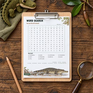May include: A word search puzzle sheet on a wooden clipboard featuring a grid of letters, a word bank with terms like crocodile and mangrove, and an illustration of crocodiles. A wooden pencil and magnifying glass are nearby.