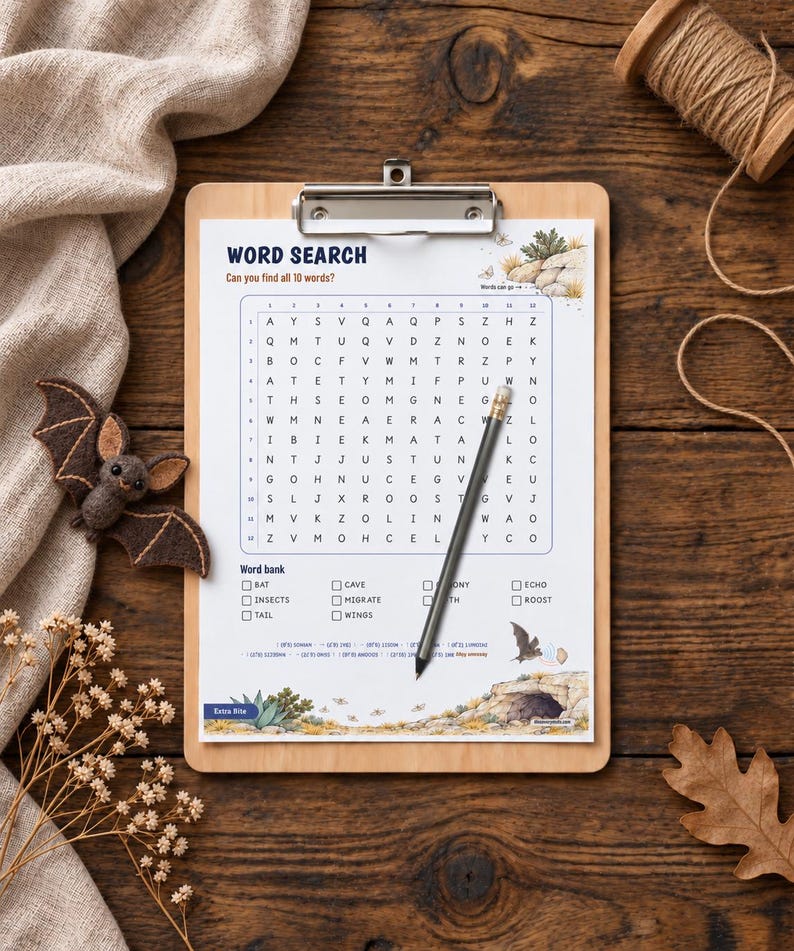 May include: A word search puzzle sheet on a wooden clipboard with a pencil resting on the grid. The sheet features the title WORD SEARCH, a 12x12 letter grid, a word bank with ten terms, and illustrations of bats and a cave entrance.