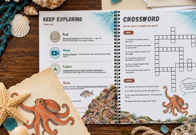May include: A spiral-bound activity book open to a page titled Keep Exploring and Crossword, featuring educational text, icons, and an octopus illustration. The page includes sections for reading, watching, and exploring, alongside a crossword puzzle grid with clues about marine life.