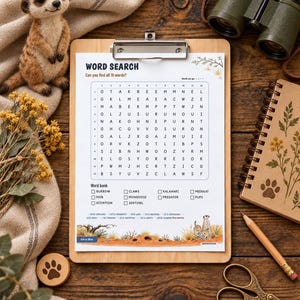K&ouml;nnte beinhalten: Ein Wortsuchr&auml;tsel auf einem h&ouml;lzernen Klemmbrett mit einem Buchstabenraster, einer Wortliste mit Begriffen wie burrow, mob und meerkat sowie einer unteren Illustration von Erdm&auml;nnchen in einer W&uuml;stenlandschaft mit dem Text Word Search.