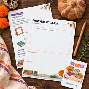 May include: A Discovery Notebook activity sheet with prompts for drawing and reflection, accompanied by a small Dia de Muertos card, a wooden pencil, a sugar skull, orange marigold flowers, and a round sweet bread roll.