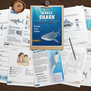 May include: A collection of educational worksheets about whale sharks, featuring illustrations, text, and activities. The central document on a clipboard is titled Whale Shark, with subheadings Discover, Learn, Explore. Includes a pencil and stapler.
