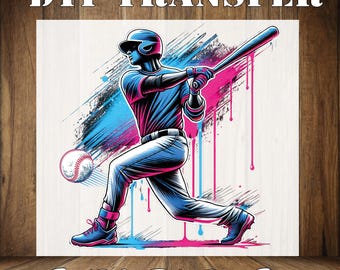 May include: A digital transfer design featuring a baseball player in a blue and pink color scheme with paint splatters and drips. The design says "DTF TRANSFER READY TO PRESS" at the top and bottom.