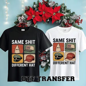 May include: Black and white t-shirts with the text "SAME SHIT DIFFERENT HAT". Each shirt features a graphic with four images of different hats and a hood. The shirts are hanging in front of a Christmas wreath.