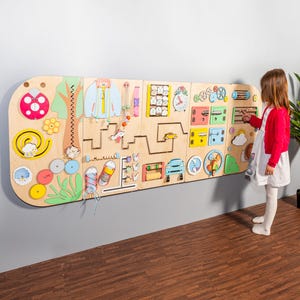 Rounded sensory wall panels in Pastel color for kids museums, libraries, waiting areas and preschool classrooms. Wall-mounted busy board.