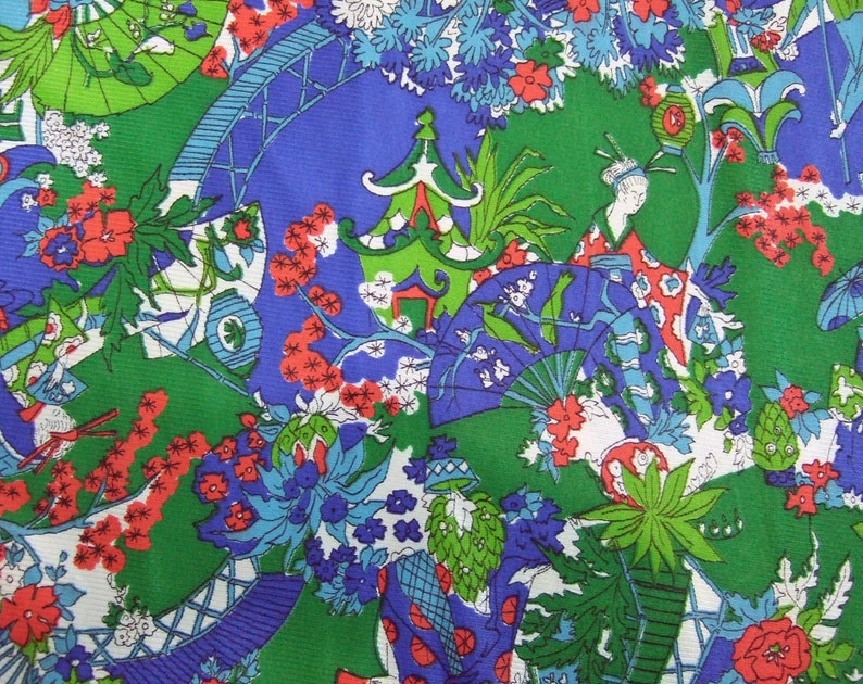 May include: A colourful fabric with a Japanese-inspired design. The pattern includes pagodas, fans, and figures in traditional dress, set against a backdrop of green, blue, red, and white. The overall aesthetic is reminiscent of vintage textiles.