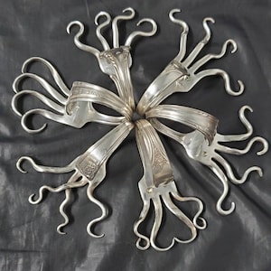 Napkin ring holders,  From forks.