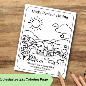May include: A black and white colouring page featuring a smiling turtle on a path with flowers, a sun, and clouds. The text reads God's Perfect Timing and He hath made every thing beautiful in his time. Ecclesiastes 3:11. The page is on a wooden surface.