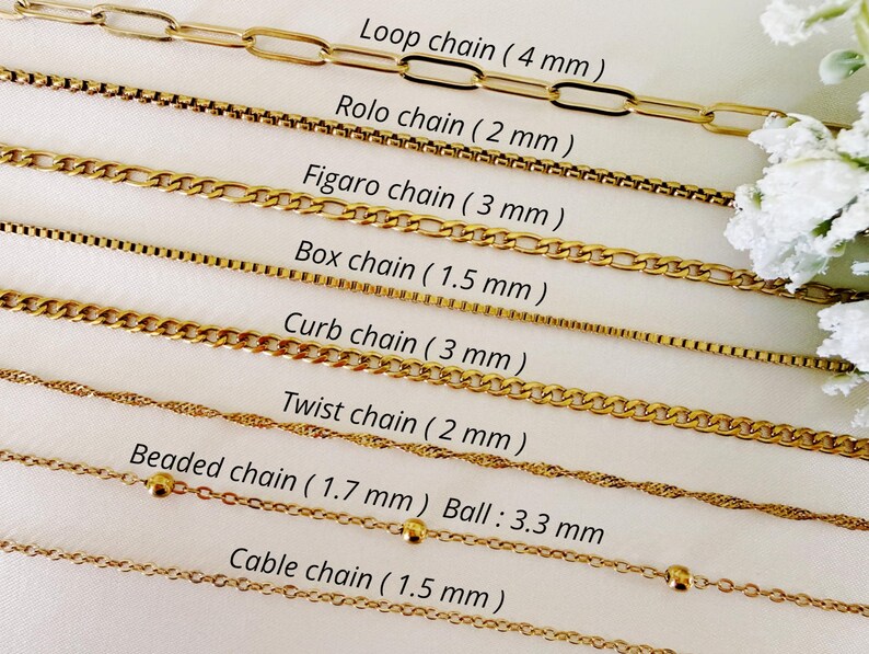 May include: A selection of gold-colored chain necklaces, each with a unique design. Styles include loop, rolo, figaro, box, curb, twist, beaded, and cable chains. Measurements are provided in millimeters for each chain style.