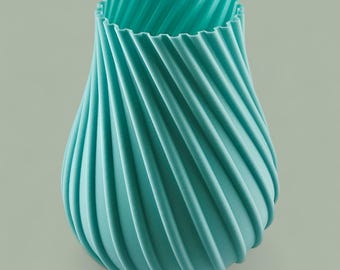 Jarrón espiral ecológico impreso en 3D en colores vibrantes. Diseño moderno e impermeable, perfecto para flores, decoración o regalos.