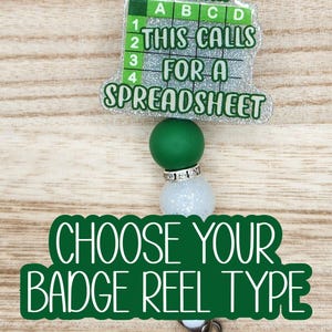 May include: A badge reel with a spreadsheet theme. The top portion features a green and silver design with the text "OOH... THIS CALLS FOR A SPREADSHEET." The bottom portion says "CHOOSE YOUR BADGE REEL TYPE."