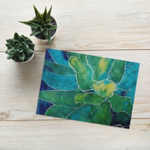 May include: Abstract painting of a green and blue flower with white lines. The painting is on a white background.