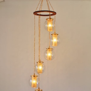 Lustre à bulles en spirale, grand luminaire suspendu à globes suspendus, 6 abat-jour de globes en verre clair avec inserts diffuseurs dorés